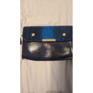 Clutch or‎ crossbody purse with card holder included